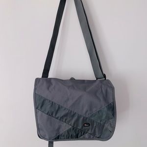 Brand new. Camera utility bag. Gray. Adjustable straps and moveable inserts